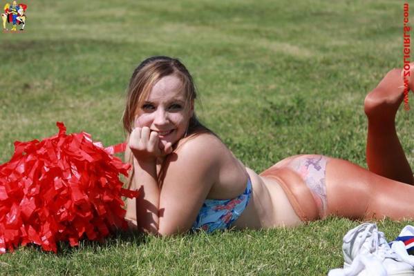 15P Cute cheerleader posing outside in her pantyhose