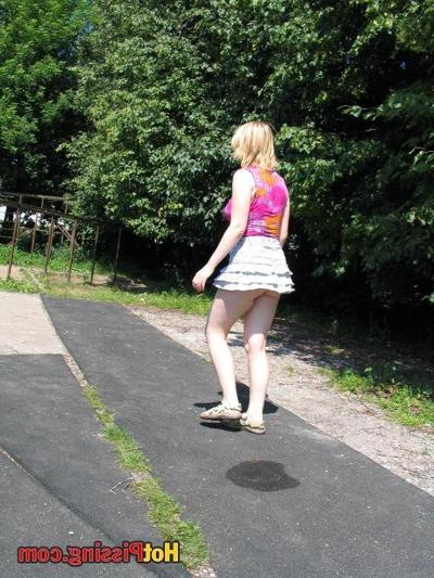 10P Voluptuous blonde bitch strikes a squatted pose and whizzes in public