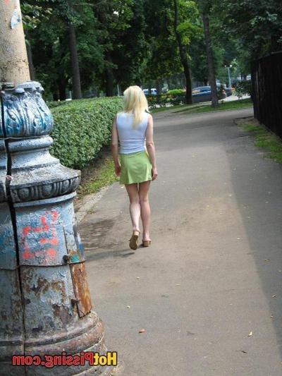 15P An almost pissed short skirt of a blondie who decided to pee outdoors