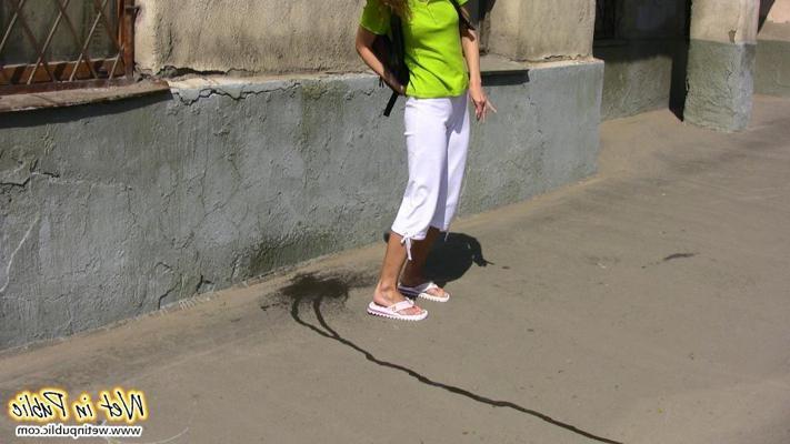 15P Slut who just pissed her white breeches right in the street