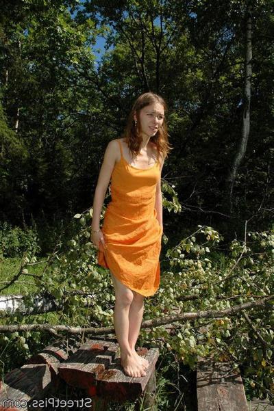 12P Young hottie in bright dress pees on forest wood