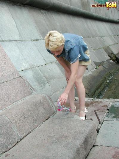 15P Adventurous blondie enjoys urinating and pussy spreading riverside