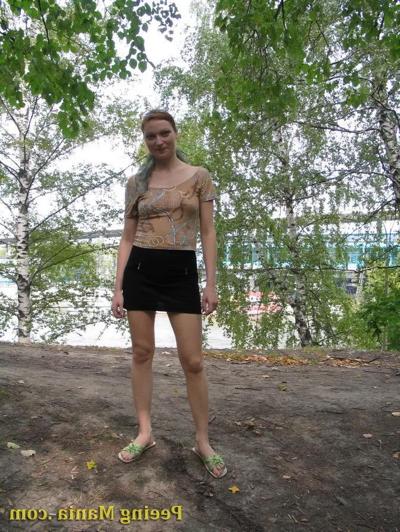 15P Longhaired beauty lifts up her skirt and squats to urinate riverside