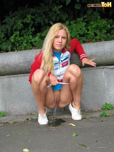 16P Cute blonde pissing in the street