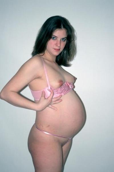 15P Girl showing her big pregnant belly