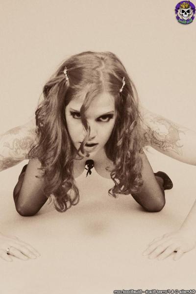 15P Classic Goth fetish Delilah shows off her corset