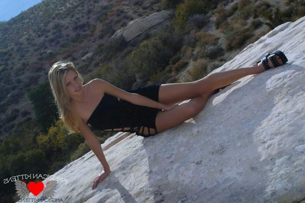 18P Ashley in a black dress outside