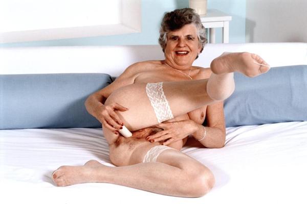 20P Horny granny in stockings spreading her hairy pussy