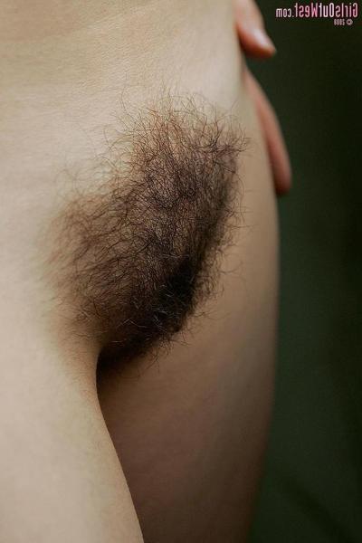 15P Amateur brunette teen spreads open her hairy pussy