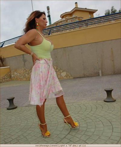 12P Sexy mature in tan stockings posing outdoors