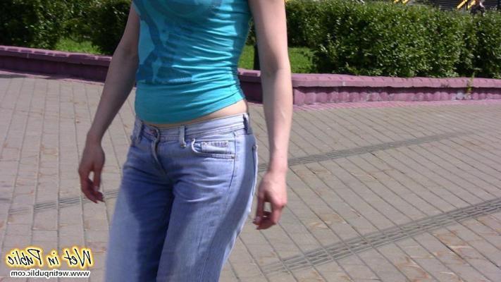 12P Red-haired chick wets her pants and changes outdoors flashing her pussy