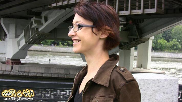 12P Nervous grin of a girl in glasses who pissed in her jeans in public