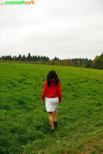 16P Barely legal brunette tinkling alone on a field