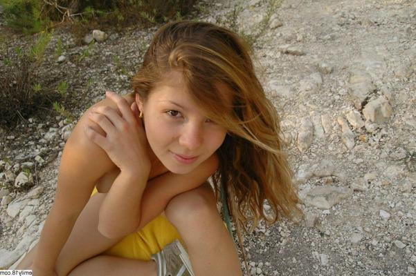 14P Young Emily showing her tits outside in the sand