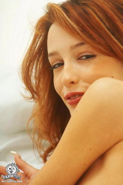 17P Attractive young skinny redhead shows naughty striptease