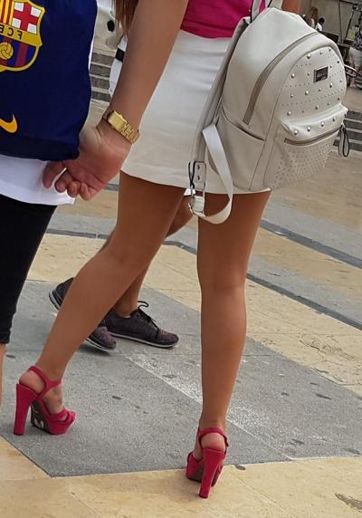 16P pretty woman in skirt, and pink heels