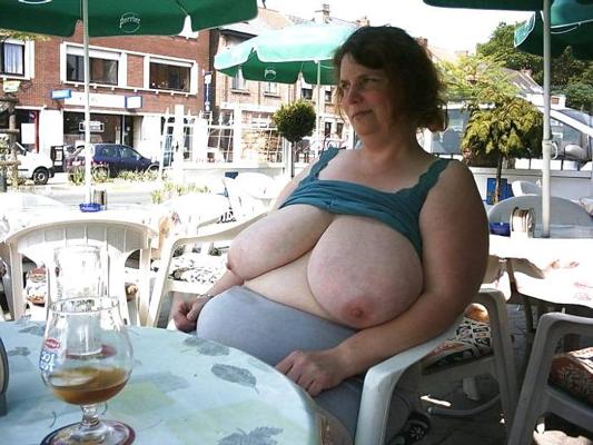 11P Huge Boobed Milf Posing in Public