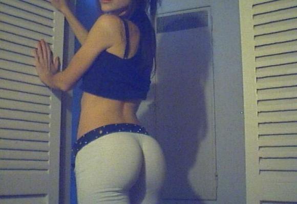 15P A brunette girl stripping