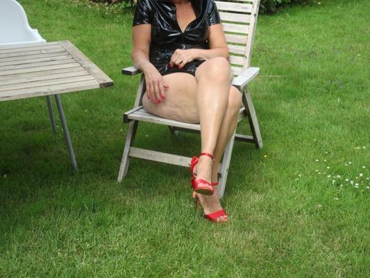 11P Red high heel shoes, black outfit, upskirt in garden